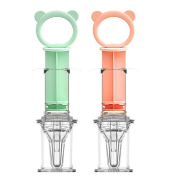Distributeur de médicament pour bébé vert et rose