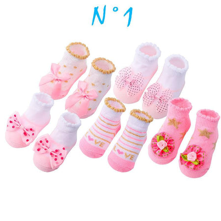 Paire de chaussette pour fille de couleur rose et blanc avec des noeuds de papillon