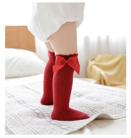 Élégantes chaussettes pour bébé en coton rose vif avec nœuds pailletés